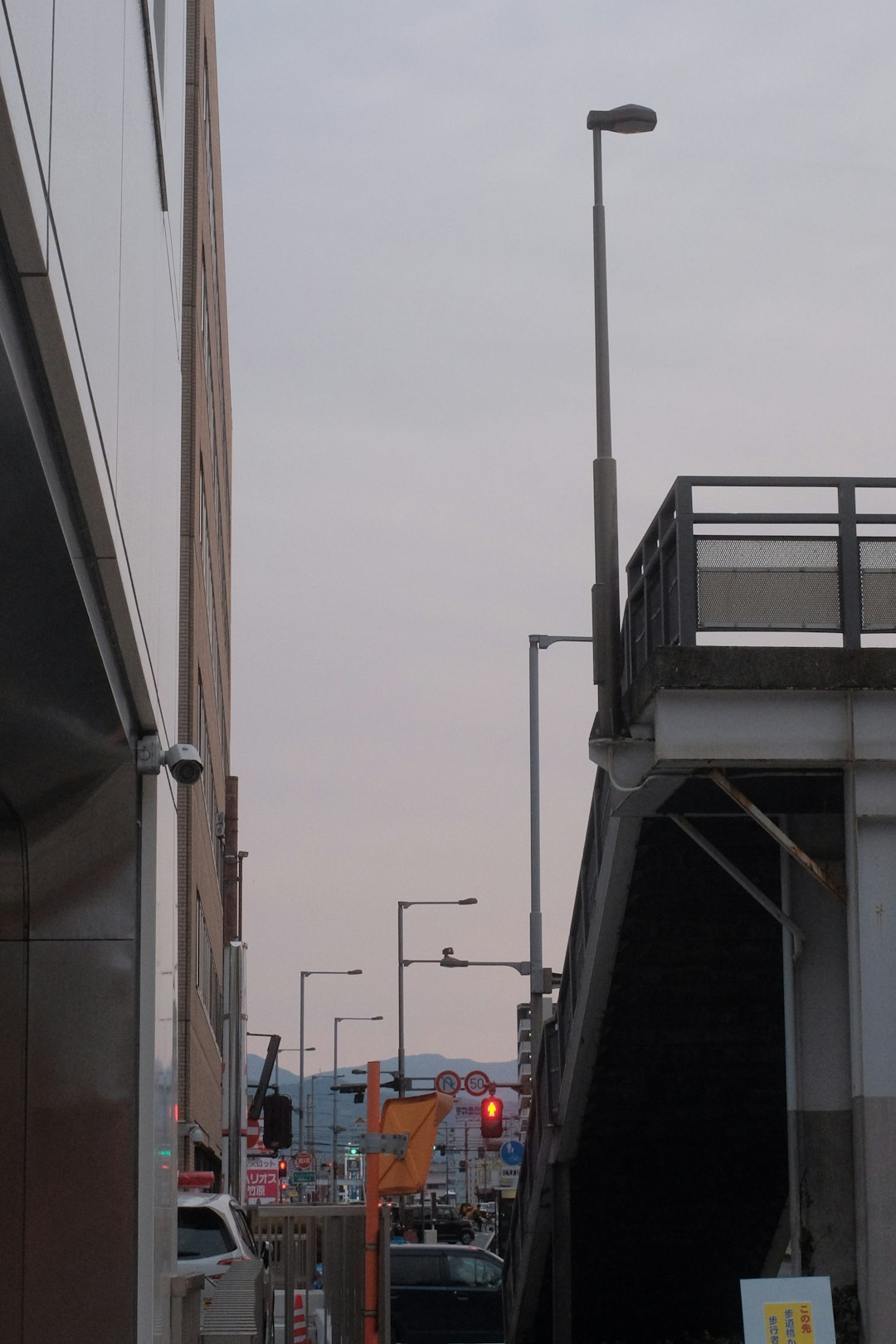 white metal ladder near brown concrete building during daytime