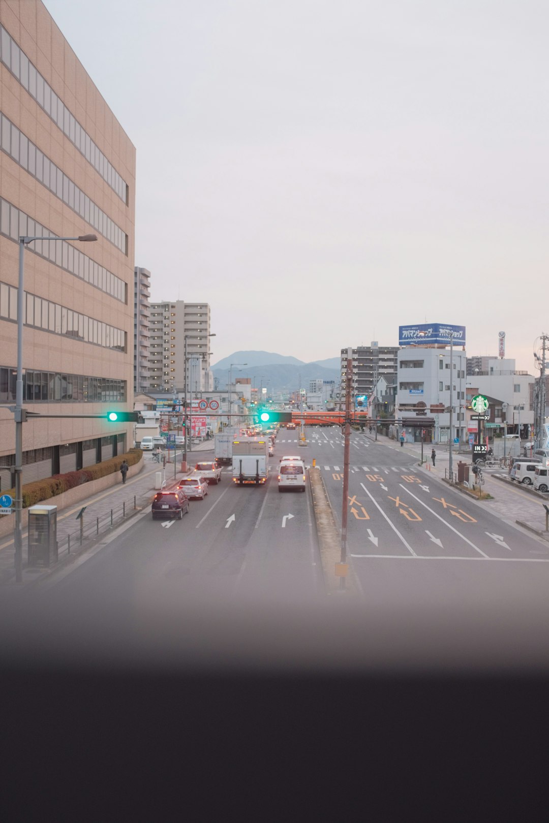 cars on road near buildings during daytime