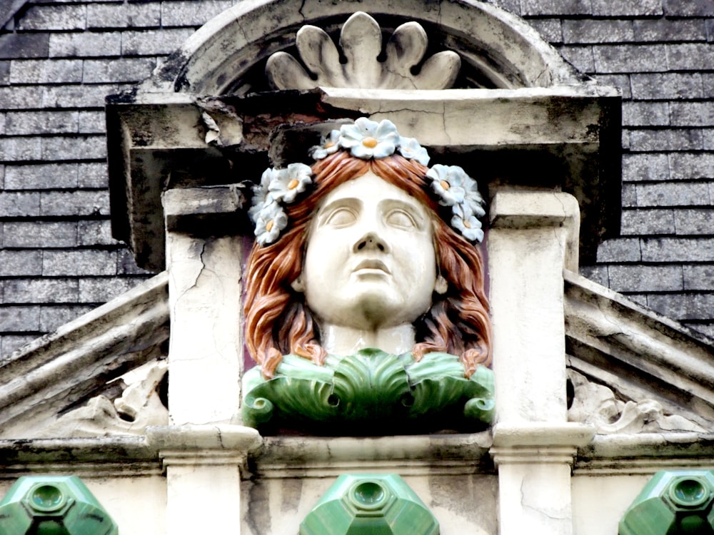 woman in green dress statue