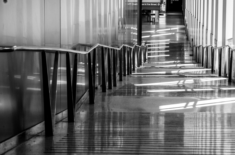 grayscale photo of empty hallway