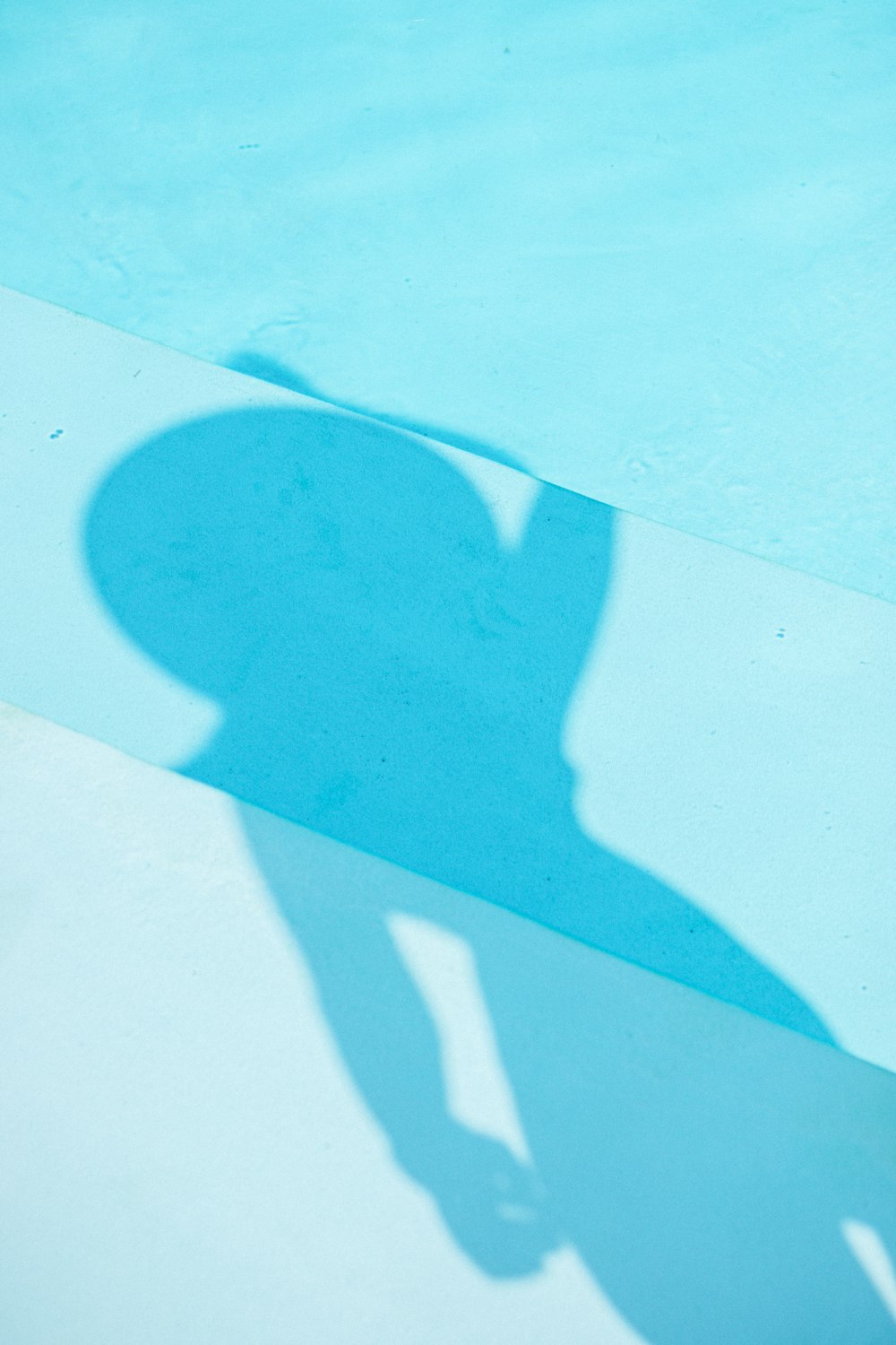 shadow of person on white sand