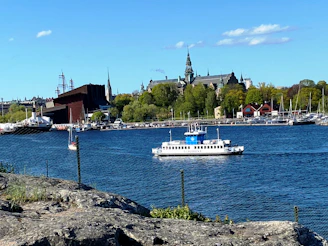A boat cruising through Stockholm’s archipelago with islands in the background.