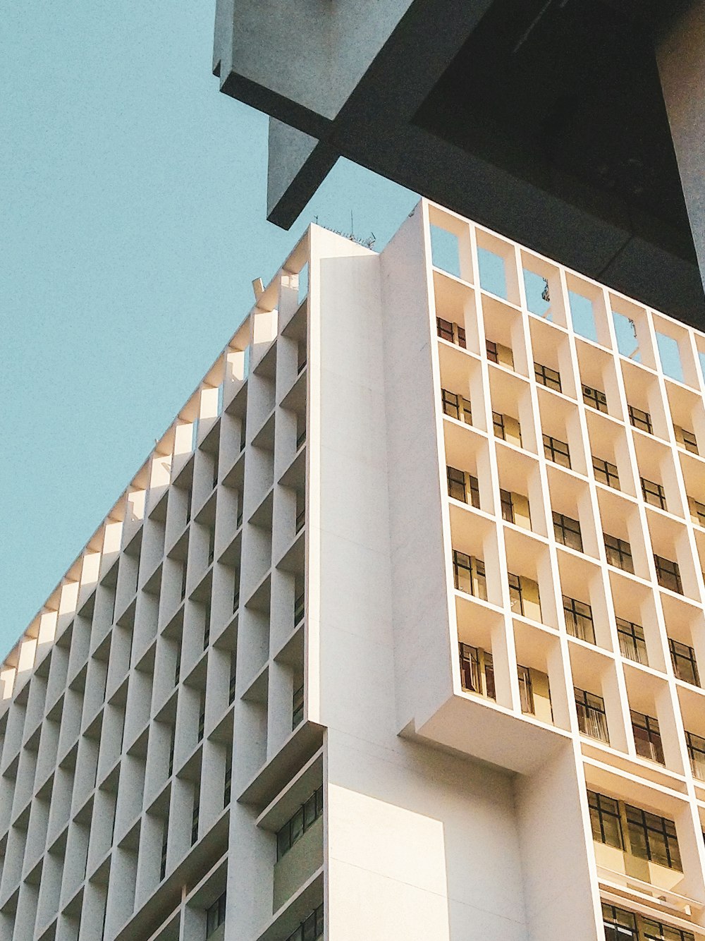 white concrete building under blue sky during daytime