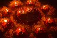Artistic arrangement of oud oils with traditional Malaysian motifs.