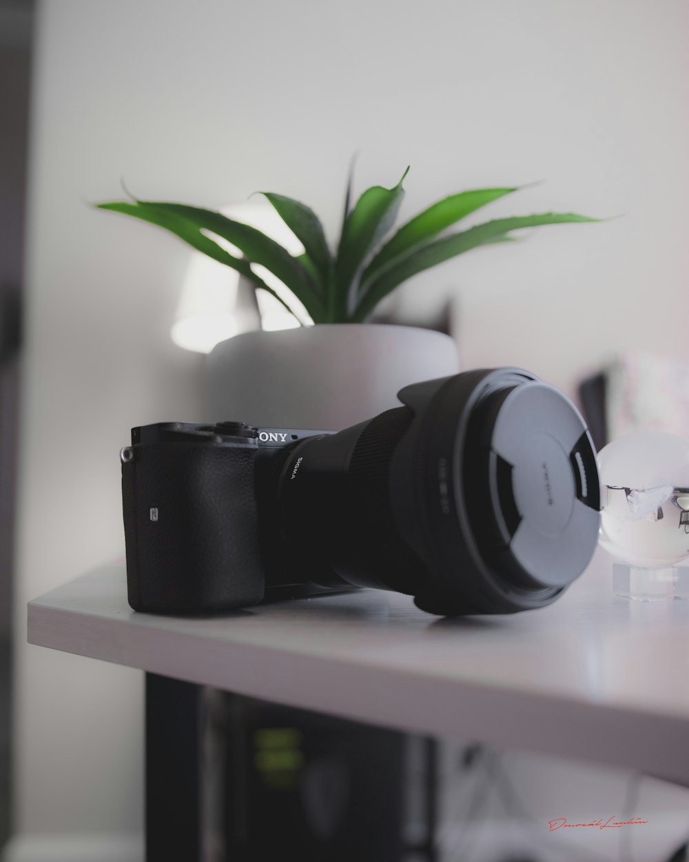 black and white headphones on white wooden shelf