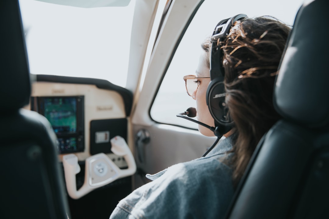 woman in white shirt wearing black sunglasses, Flying in a 4 seater plane