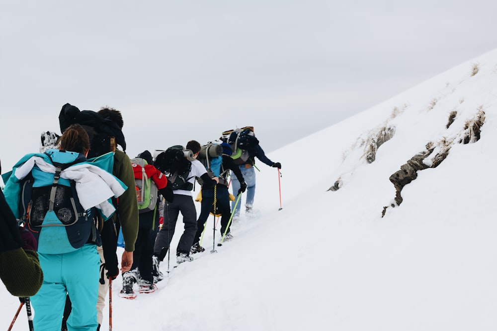 people on snow covered mountain during daytime