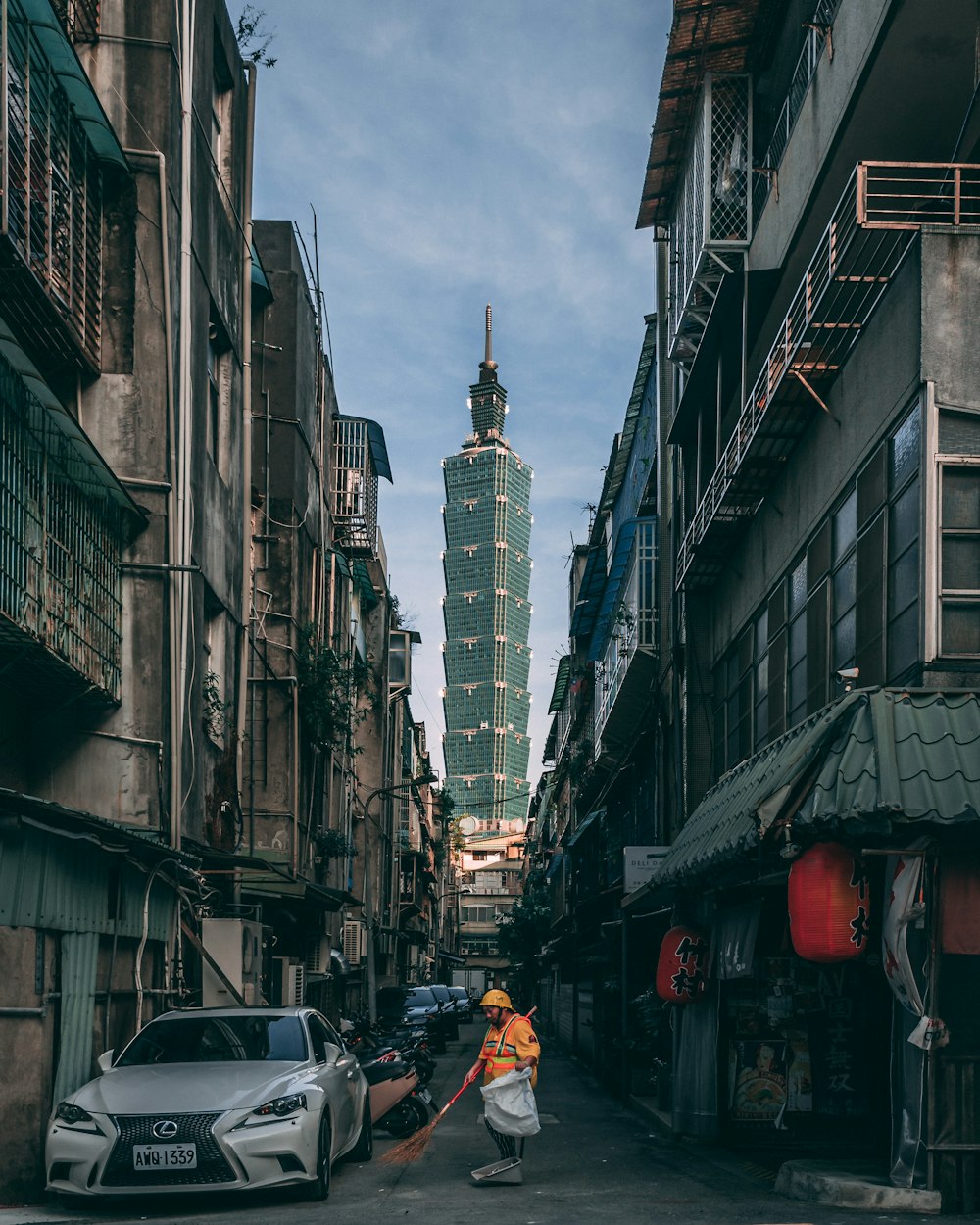 people walking on street between buildings during daytime