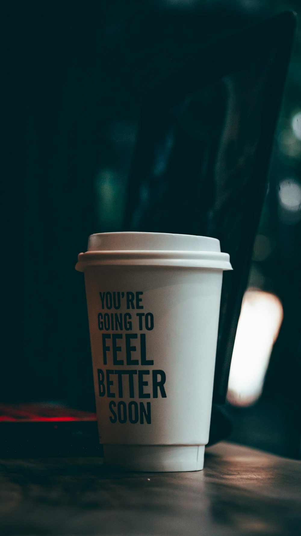 white and black coffee cup