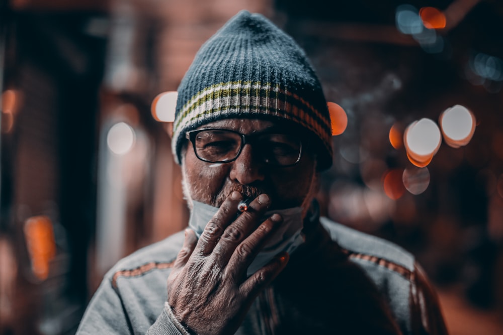 man in gray jacket wearing knit cap