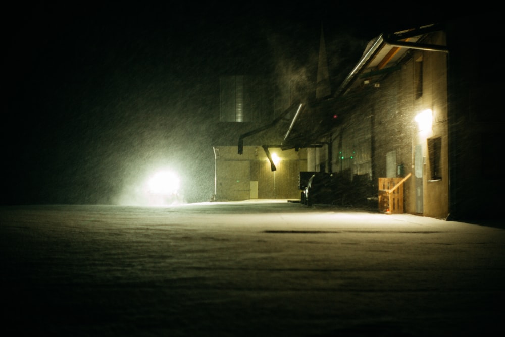 brown wooden house with light turned on during night time