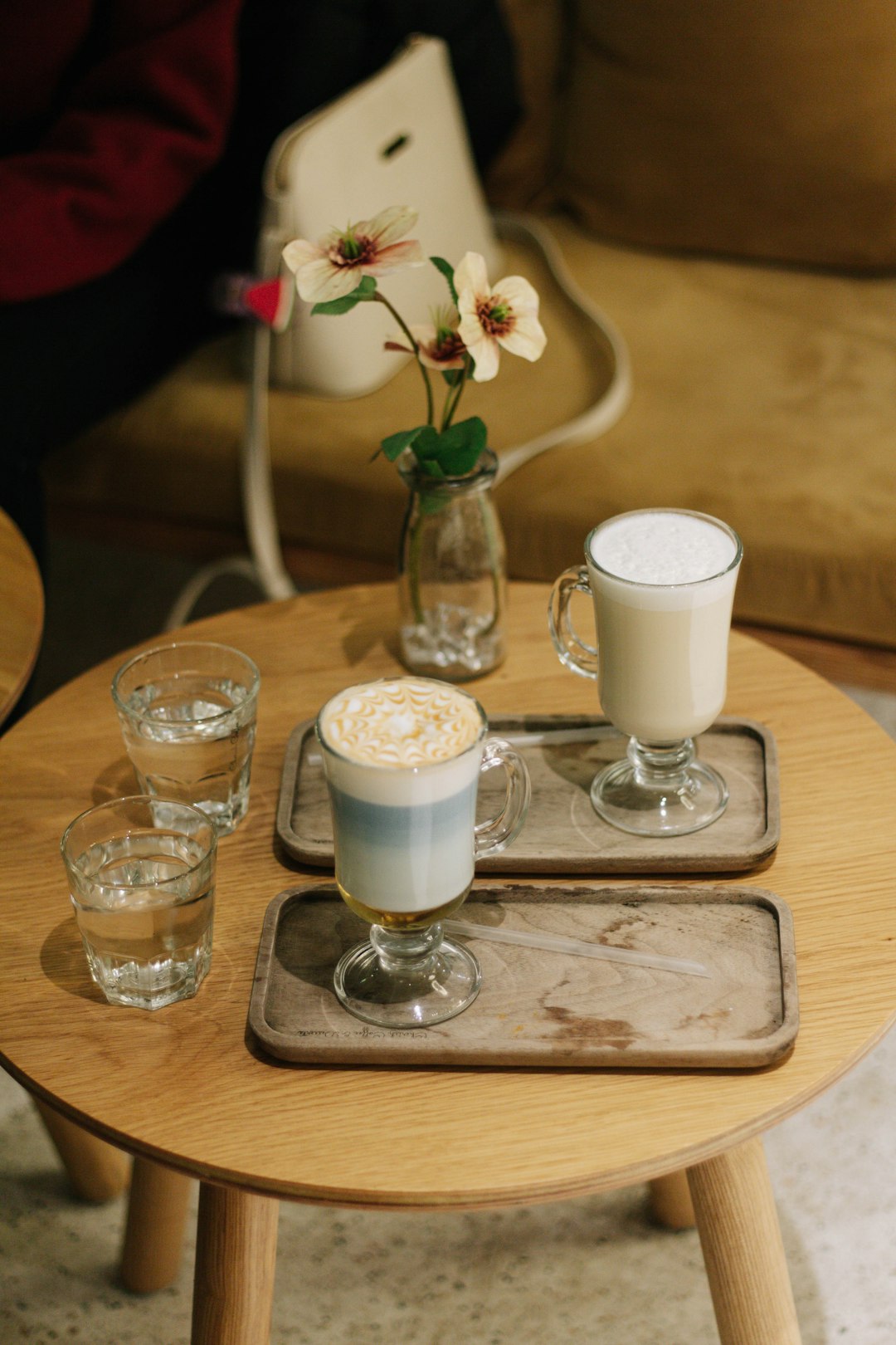 clear glass cup on brown wooden table