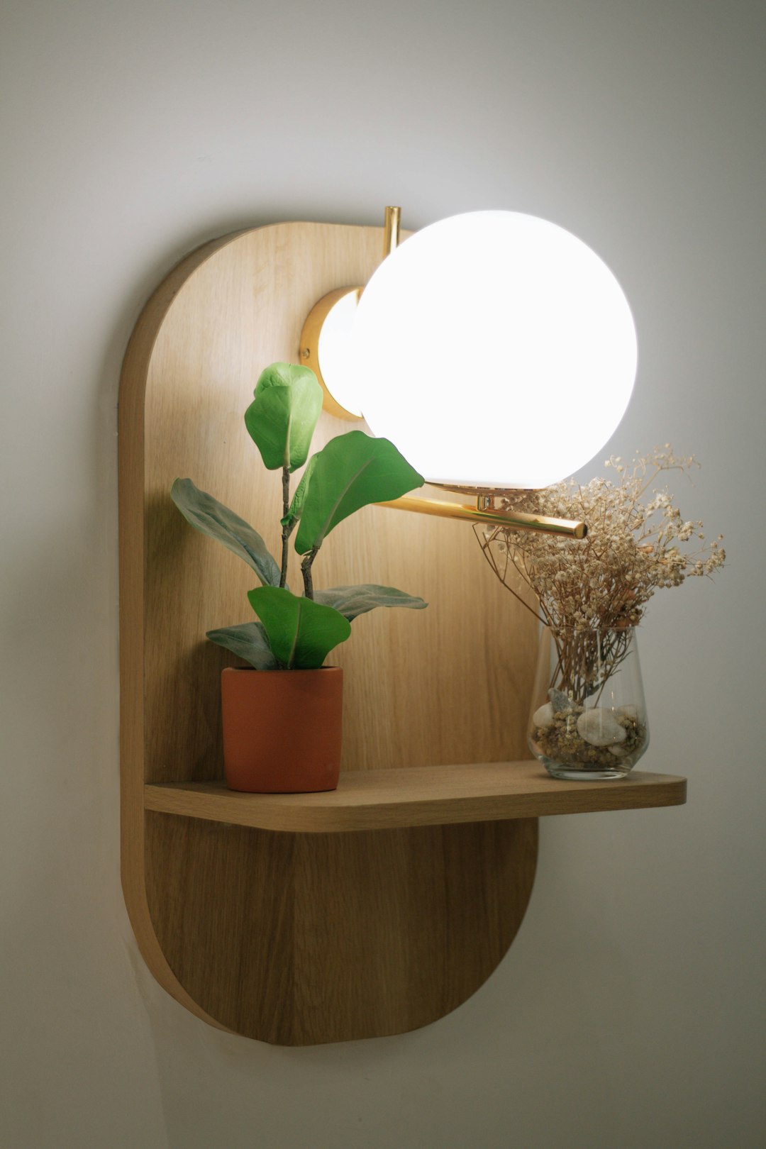 white and brown table lamp on brown wooden table