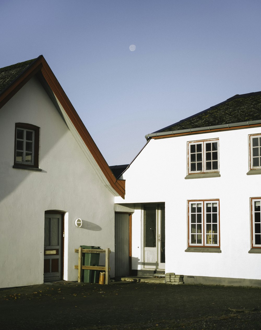 white and brown concrete house under blue sky during daytime