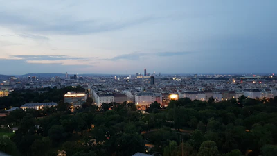 A panoramic view of Calicut cityscape from a high vantage point during twilight.