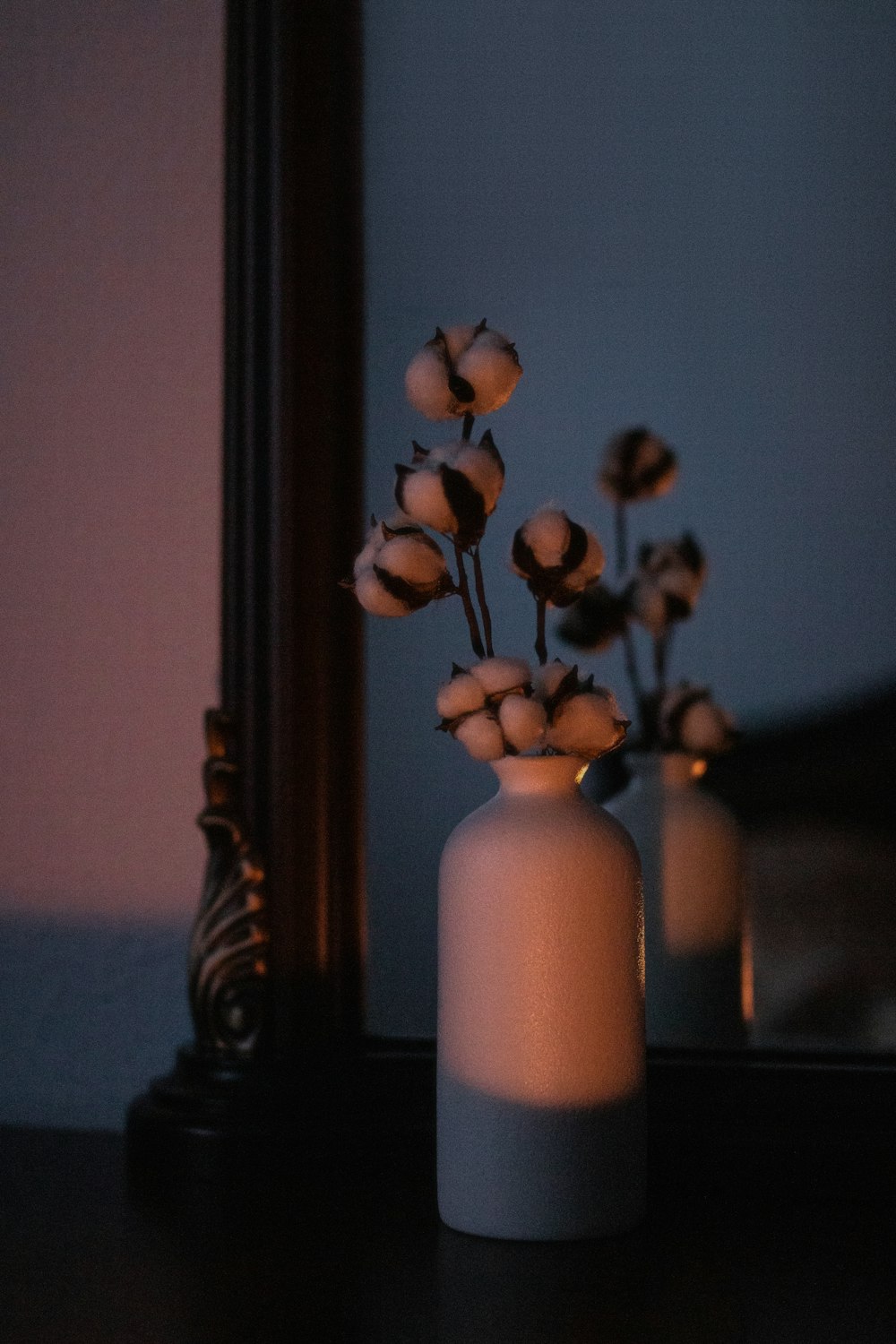 white ceramic vase with yellow flowers