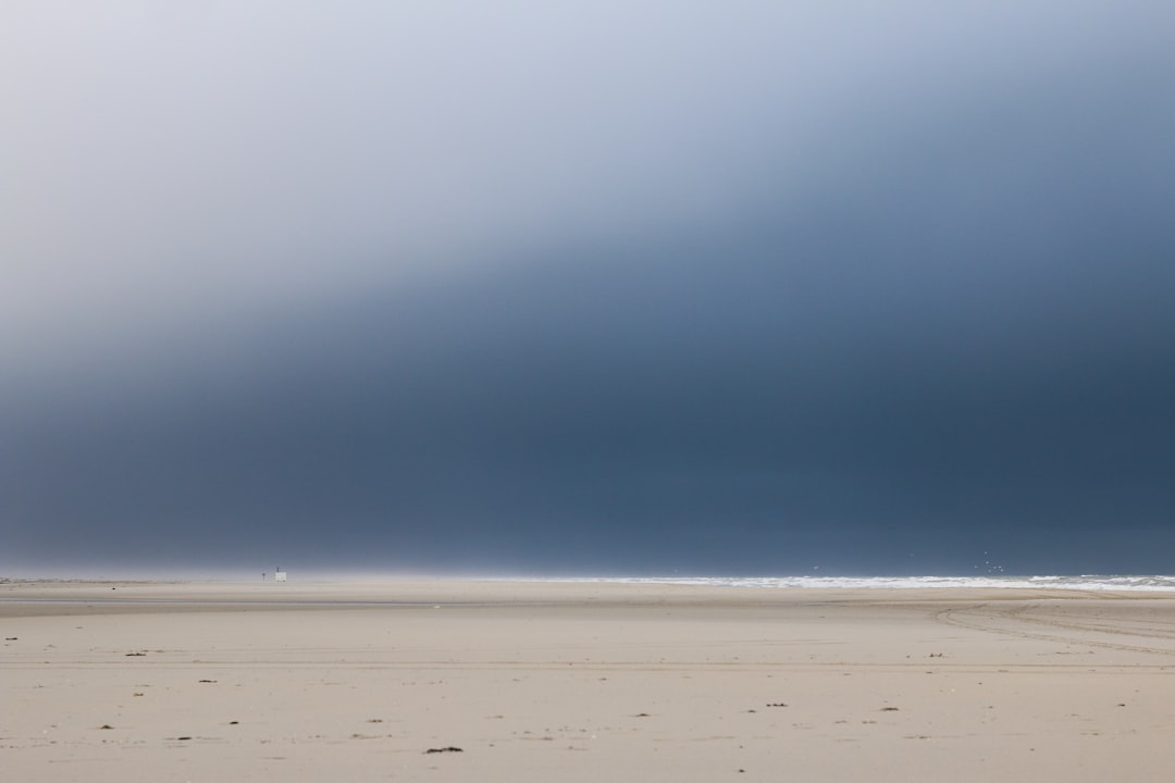 white sand under blue sky during daytime