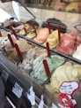 A delicious array of artisanal gelato flavors on display.