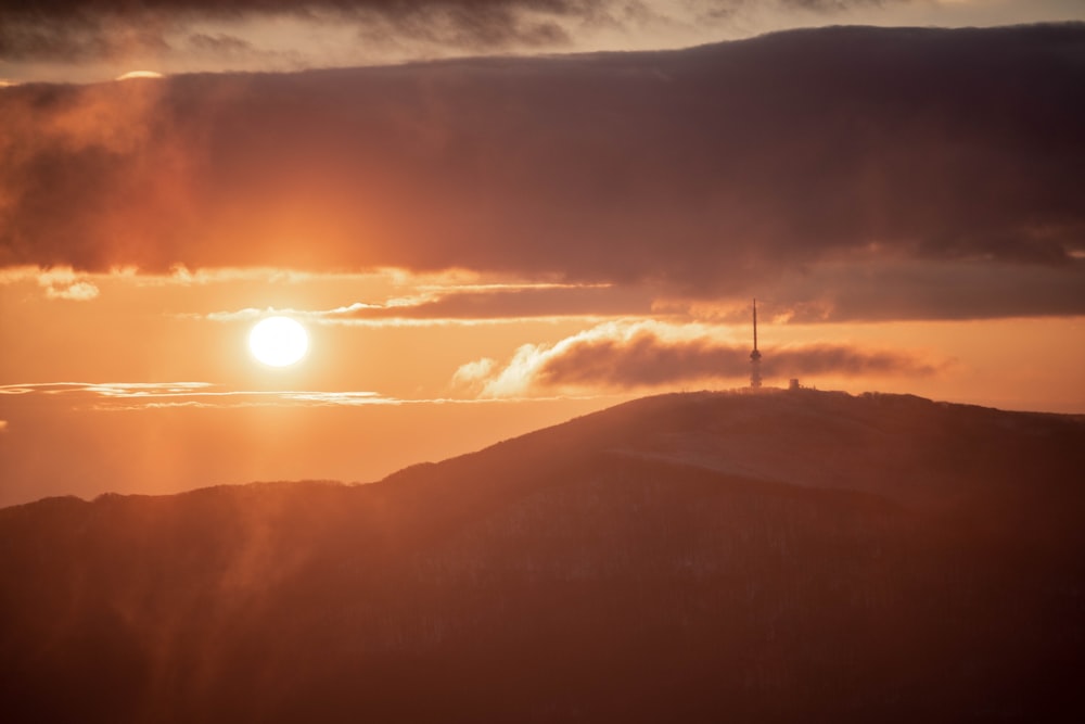 silhouette of mountain during sunset