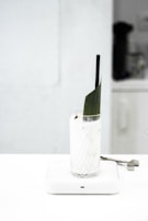 clear drinking glass with black straw