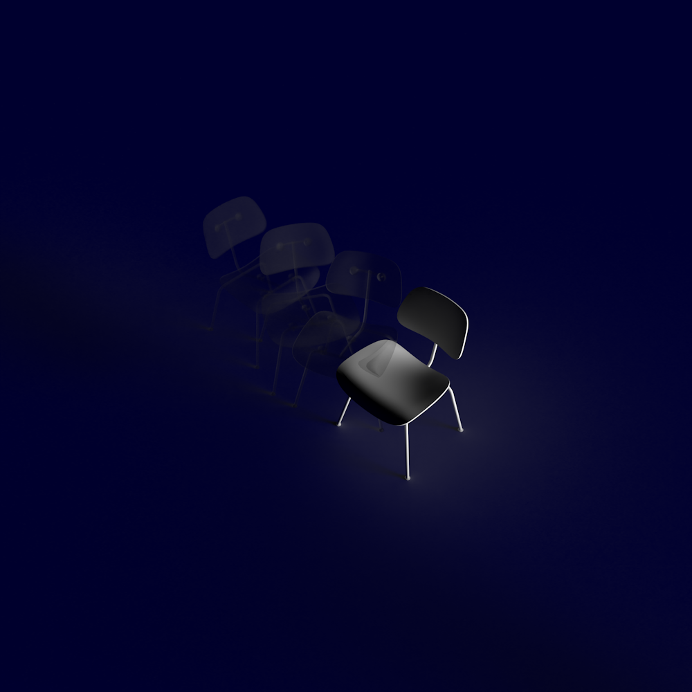 grayscale photo of chairs on white room