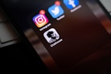 black smartphone showing icons with icons