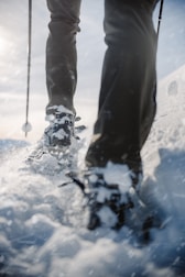An adventure seeker trekking in waterproof insulated boots.