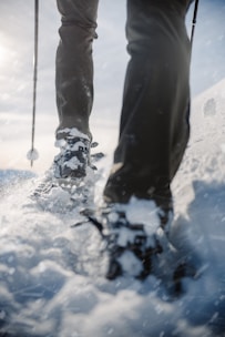 An adventure seeker trekking in waterproof insulated boots.
