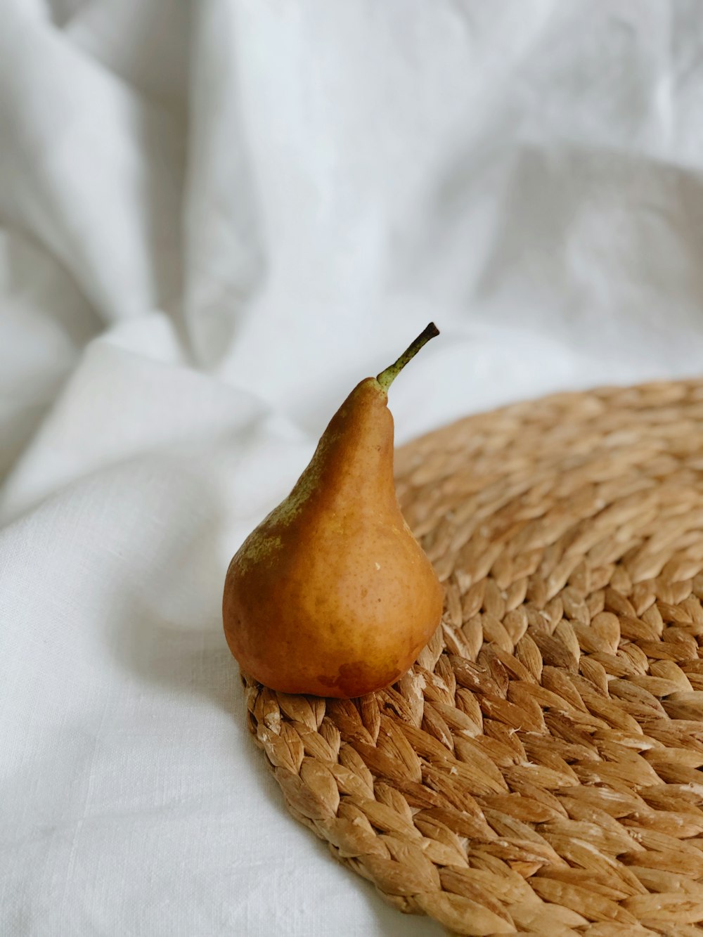 brown fruit on white textile