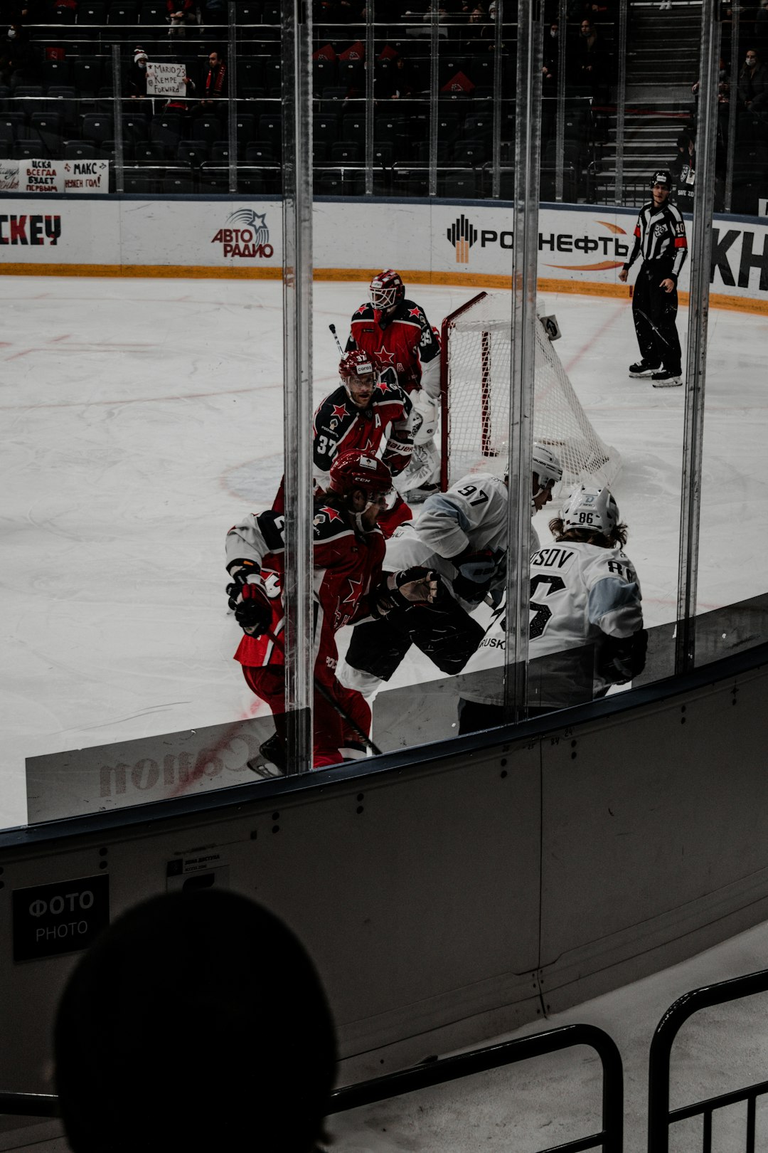  ice hockey players on ice field match stick