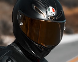 person in black helmet and black helmet