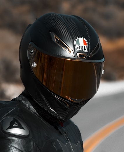 person in black helmet and black helmet