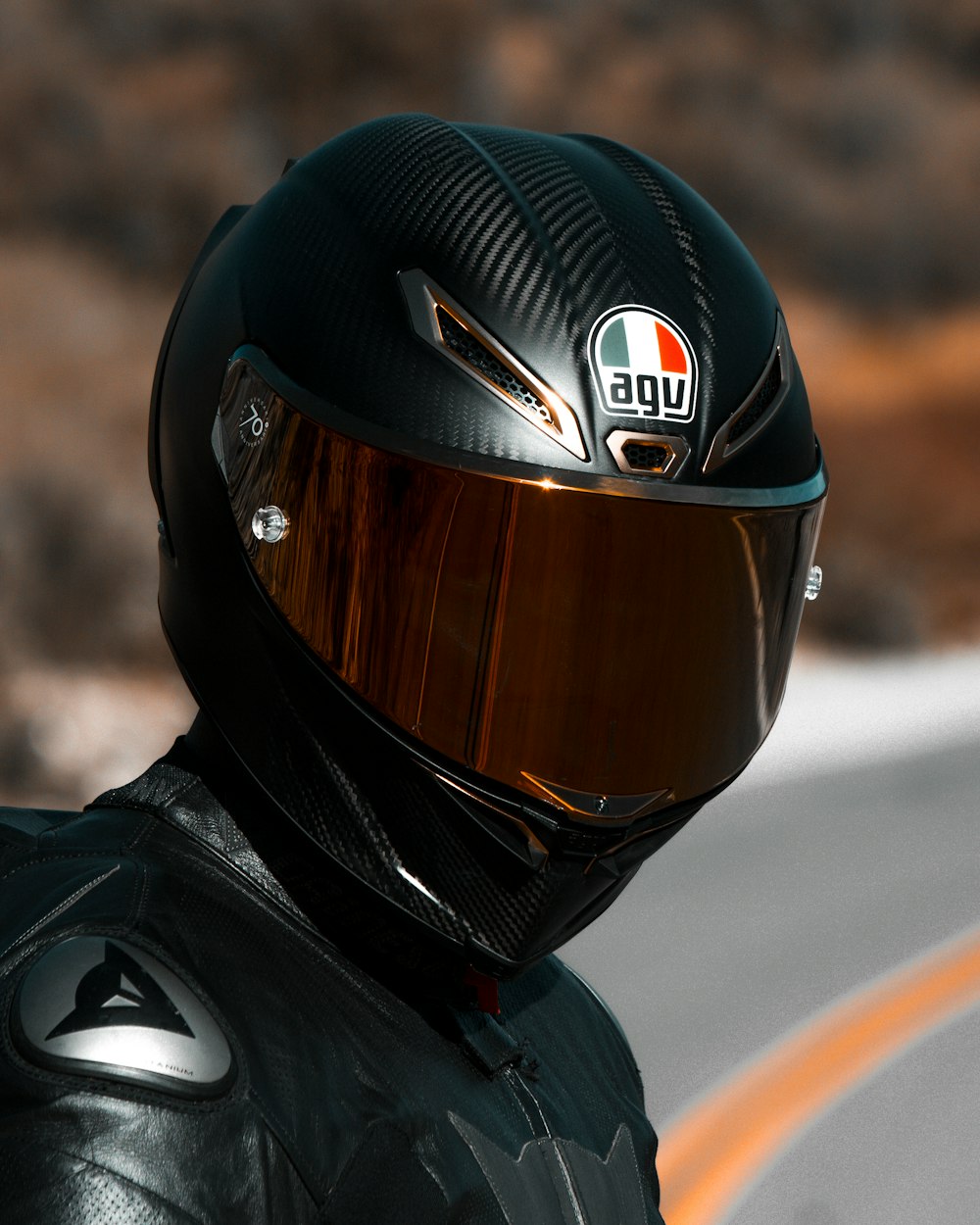 person in black helmet and black helmet