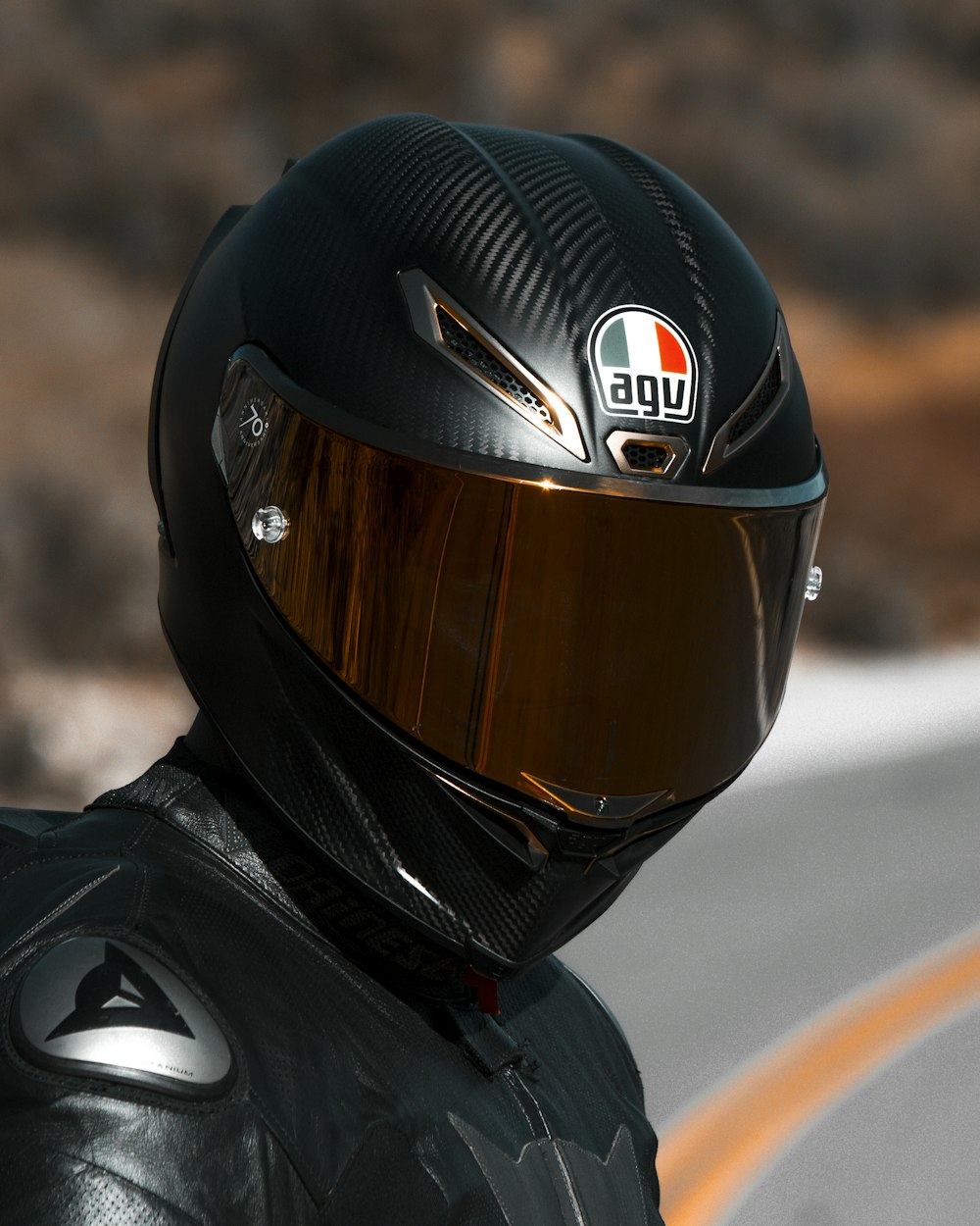 person in black helmet and black helmet