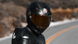 man in black helmet and black jacket