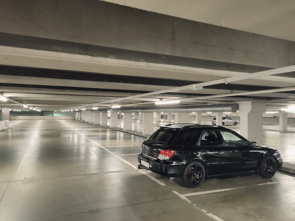 black suv in a parking lot