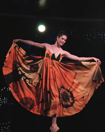 woman in red dress dancing