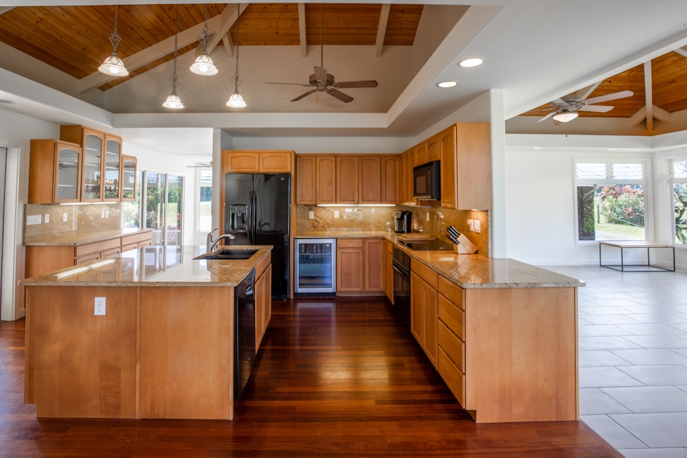 brown wooden kitchen cabinet with white kitchen counter top