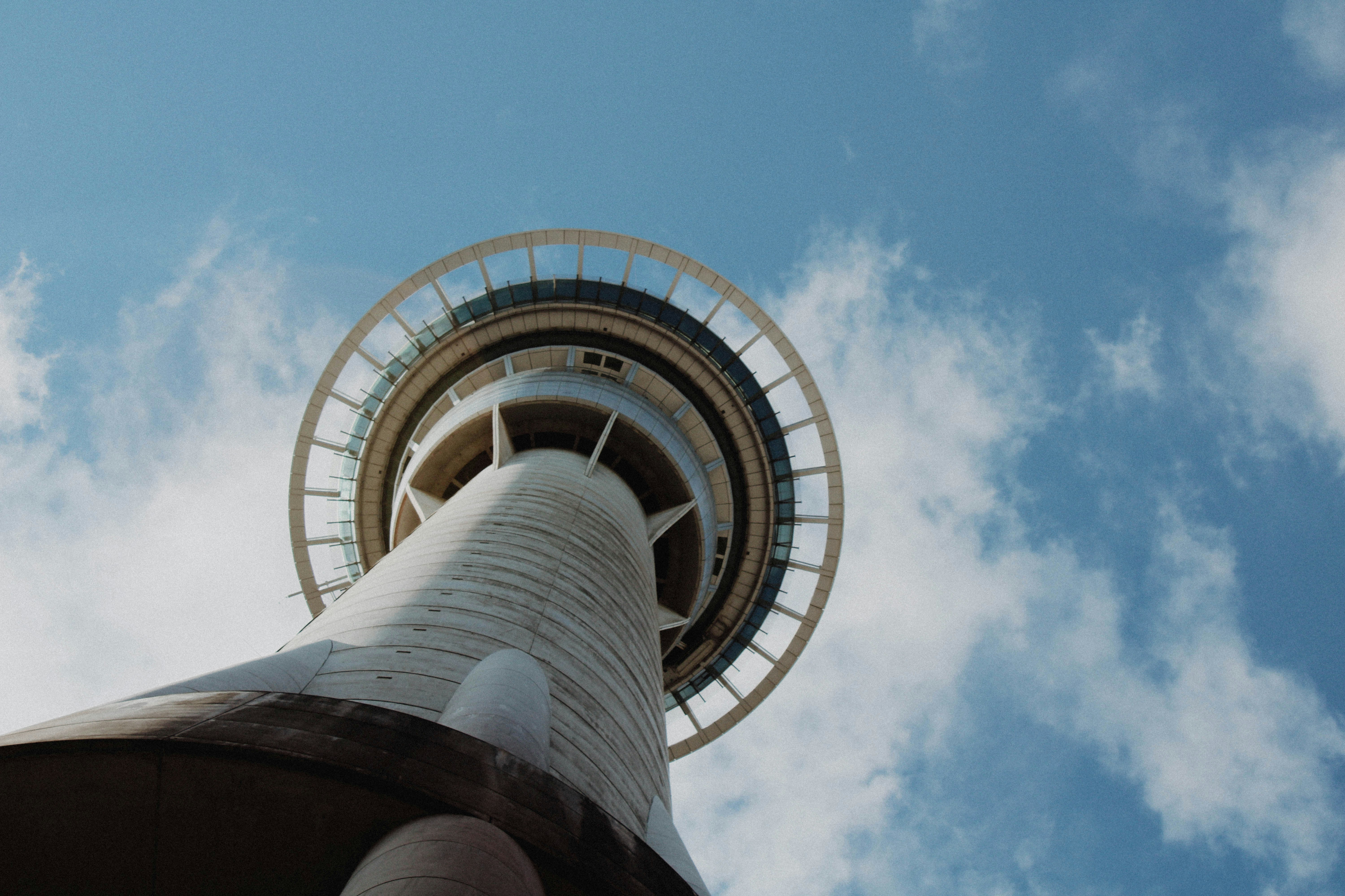 white and black tower under blue sky