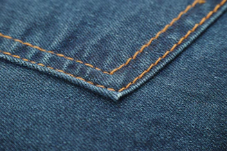 blue denim textile with white button