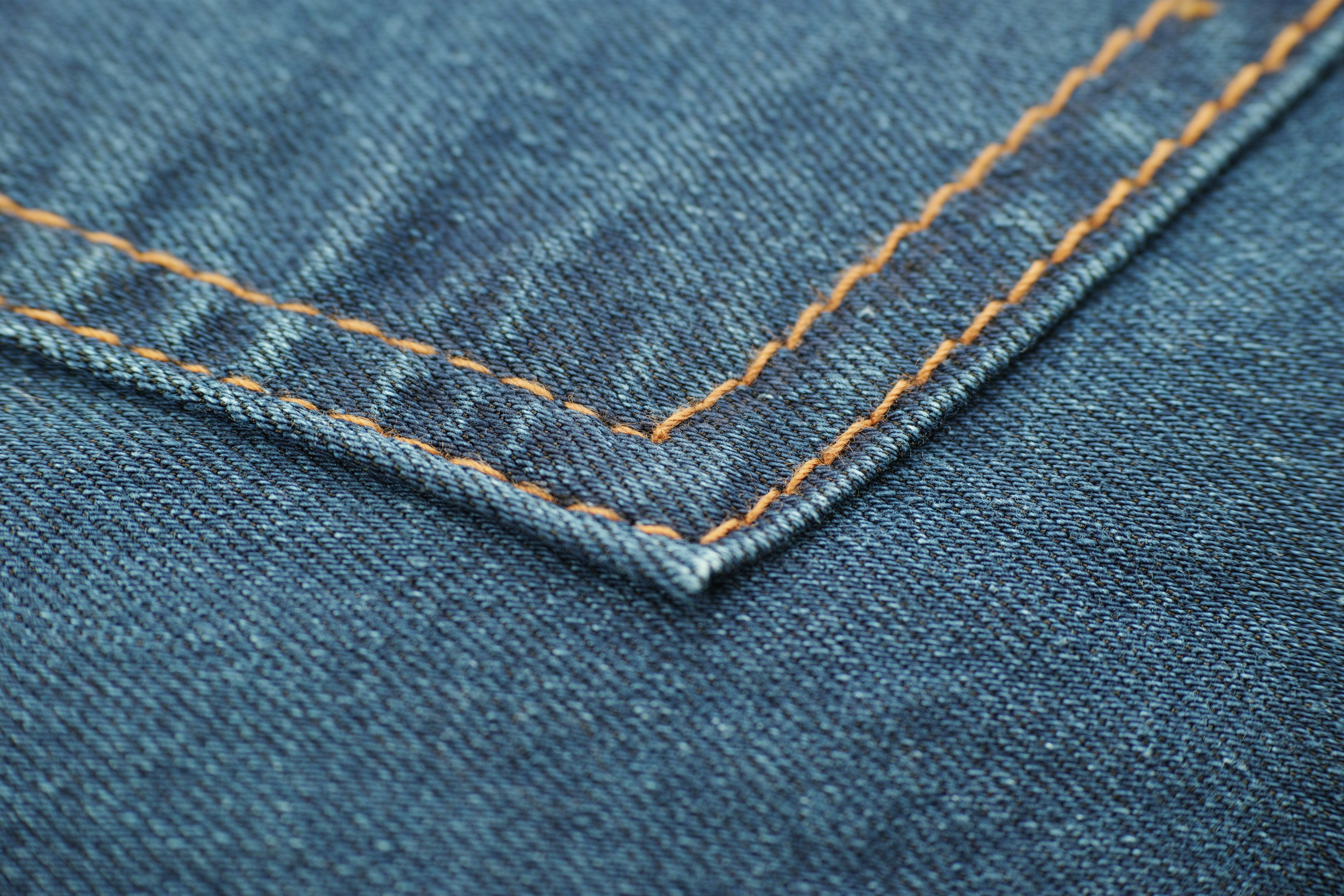 blue denim textile with white button