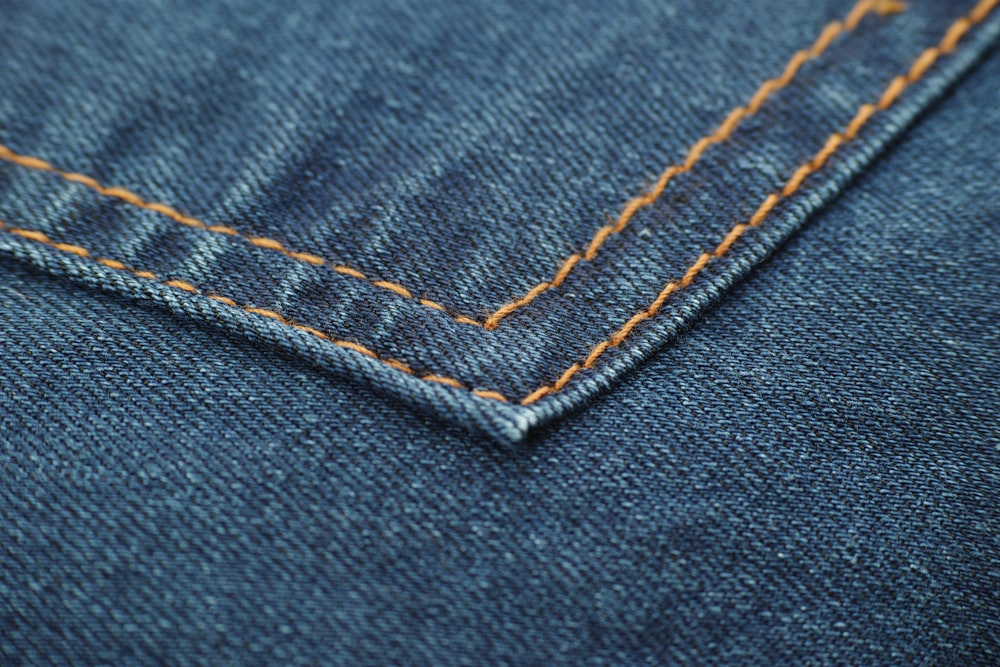 blue denim textile with white button