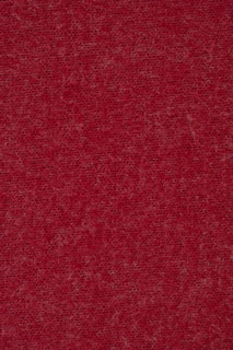 Close-up of burgundy fabric showing fine weave and subtle sheen