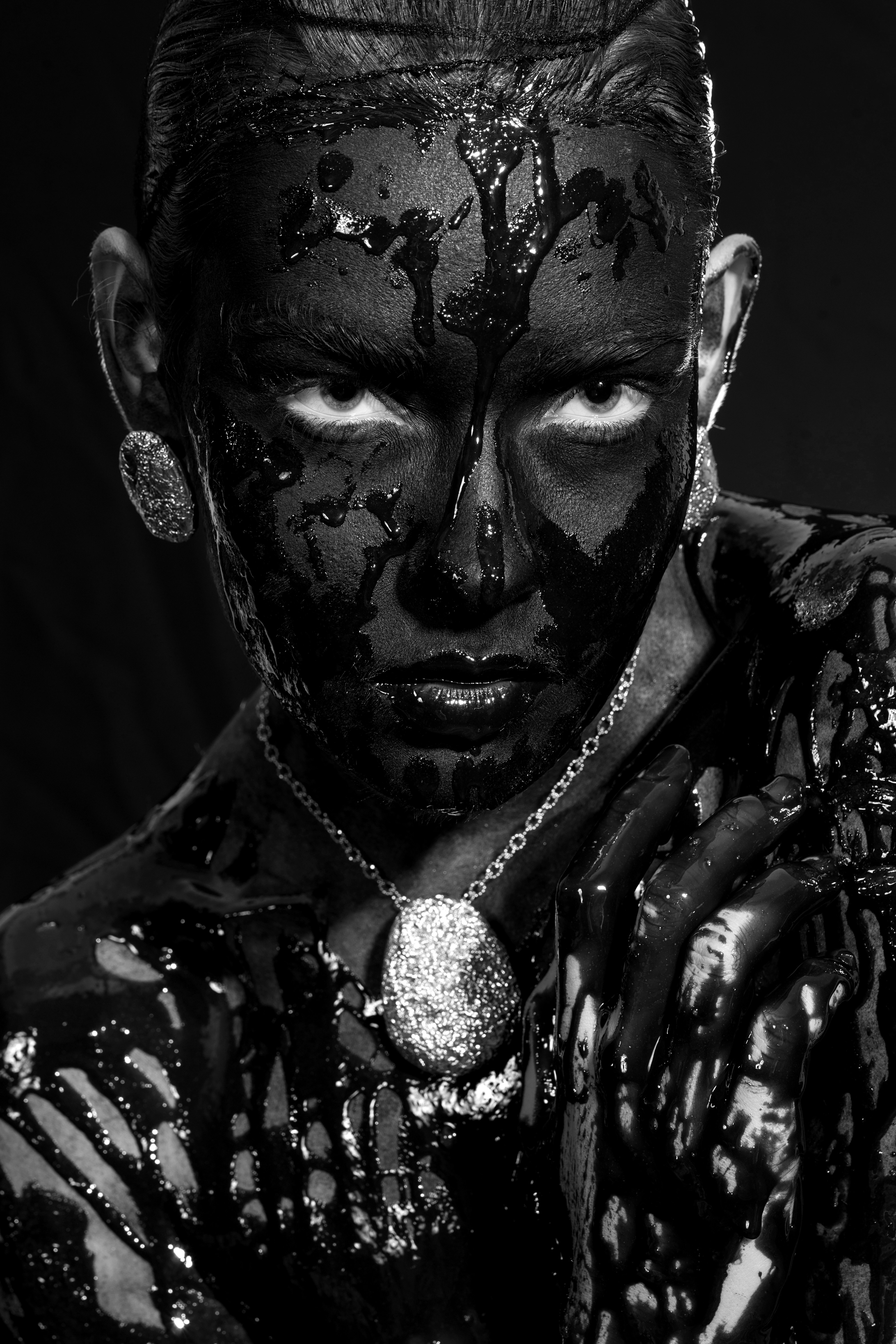 black and white mans face statue