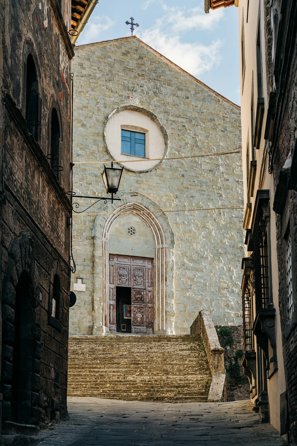 brown brick building with white window