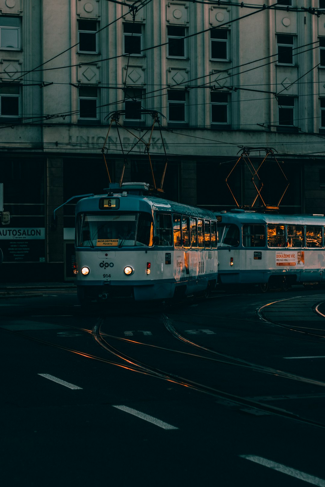 white and red train on rail road during daytime