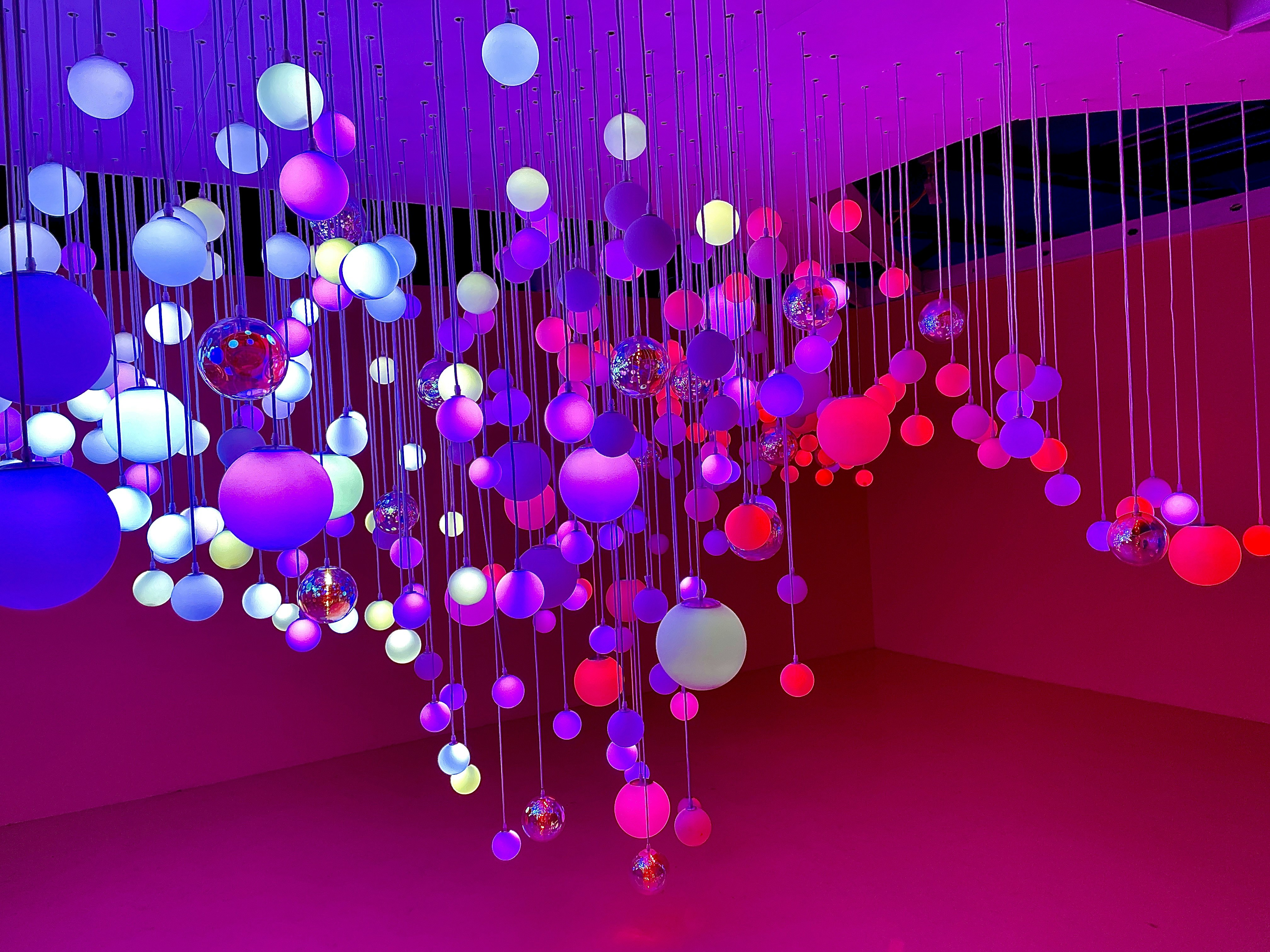 pink and white balloons on red background