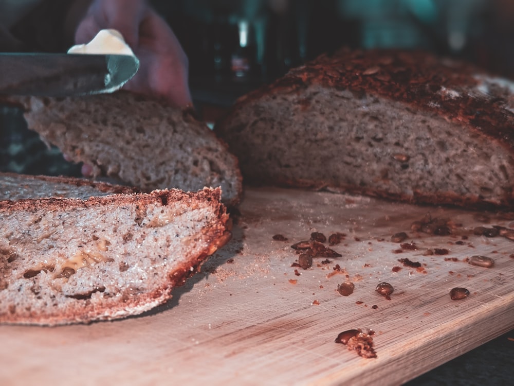 sliced bread on brown wooden chopping board