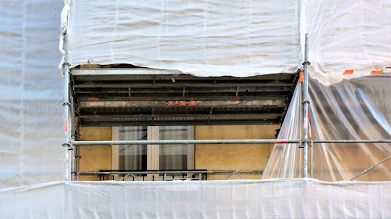 white curtain on window during daytime