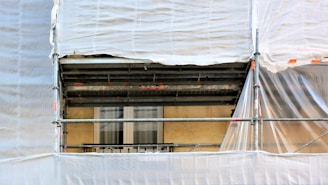 white curtain on window during daytime